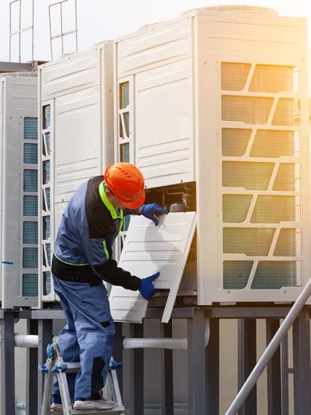 people-repairing-industrial-air-conditioner